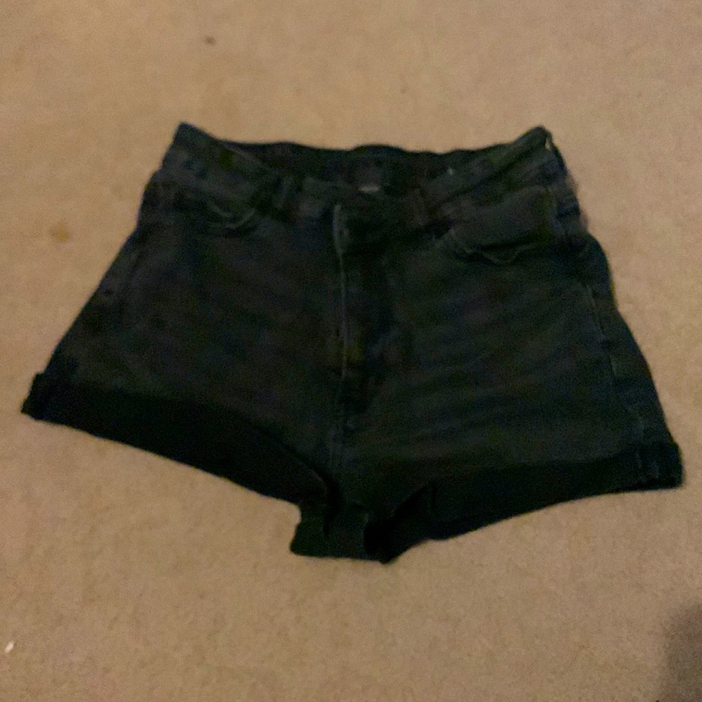 Black stretchy American Eagle jeans with a cross over waist
